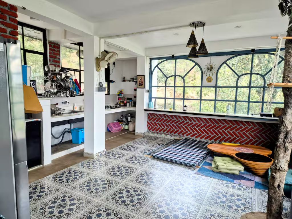 Living room with a tree growing through it